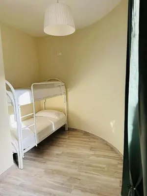 Letto o letti in una camera di Villa Blue Paradise Relax con piscina a pochi minuti da Cagliari e dal mare