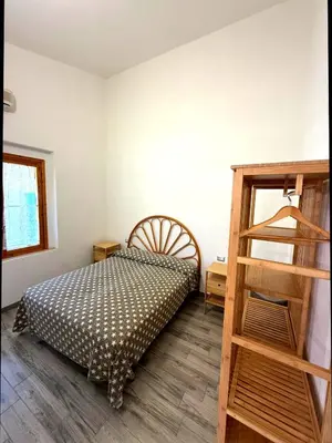 Letto o letti in una camera di Villa Alice - Villetta con giardino privato a pochi minuti dal mare - Villasimius