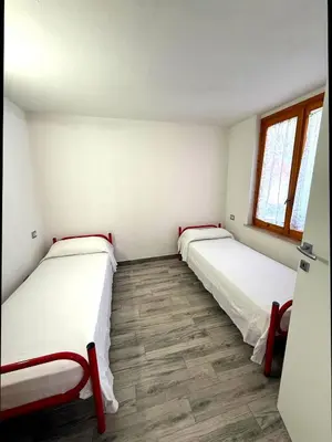 Letto o letti in una camera di Villa Alice - Villetta con giardino privato a pochi minuti dal mare - Villasimius