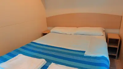 Letto o letti in una camera di Spinnaker