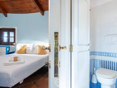 Letto o letti in una camera di Villa Giada