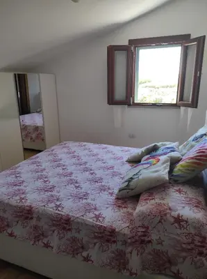 Letto o letti in una camera di Villetta vista mare immersa nel verde