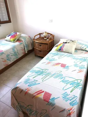 Letto o letti in una camera di Villetta vista mare immersa nel verde