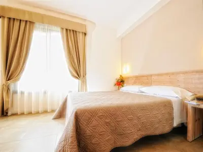 Letto o letti in una camera di Le Cale