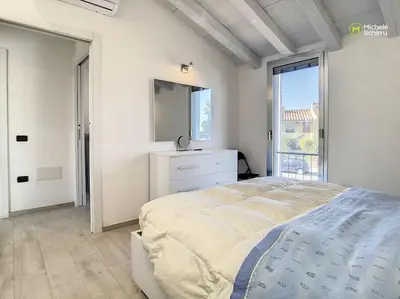 Letto o letti in una camera di Cagliari Poetto the sea a few steps from the beach