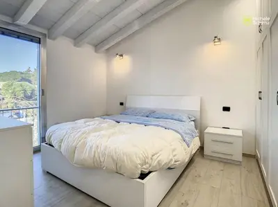 Letto o letti in una camera di Cagliari Poetto the sea a few steps from the beach