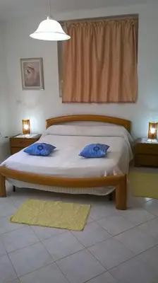 Letto o letti in una camera di Sa Domu Sarda casa vacanza