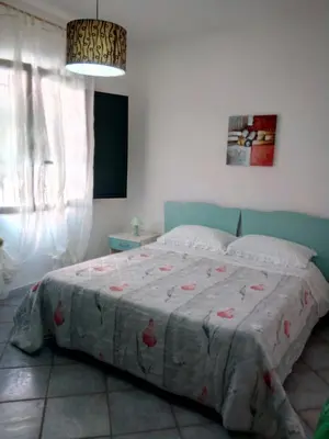 Letto o letti in una camera di Sa Domu Sarda casa vacanza