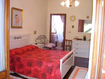 Letto o letti in una camera di Sa Domu Sarda casa vacanza