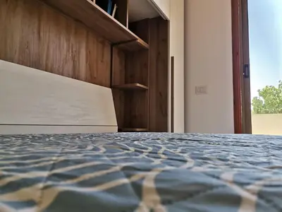 Letto o letti in una camera di Santa Luria Casa dolce Casa