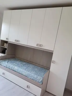 Letto o letti in una camera di Santa Luria Casa dolce Casa