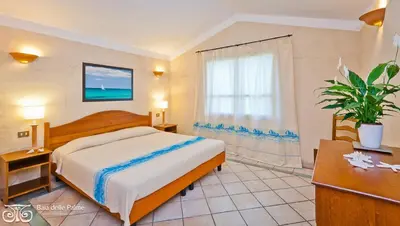 Letto o letti in una camera di Superb Residence Baia delle Palme Studio Mono