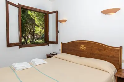 Letto o letti in una camera di Residence Baia delle Palme nm1222