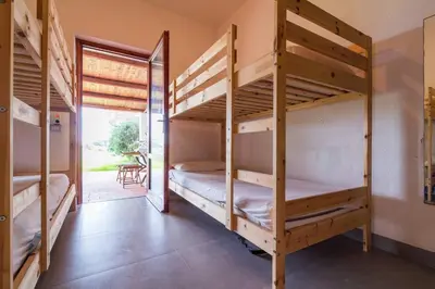 Letto o letti in una camera di Beach House, on the sand