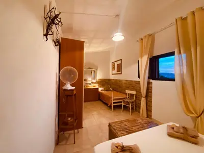 Letto o letti in una camera di Guest House Calalunga Scogliera
