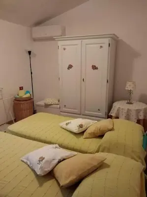 Letto o letti in una camera di Appartamento Ginepro