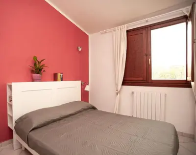 Letto o letti in una camera di Casa Nettuno