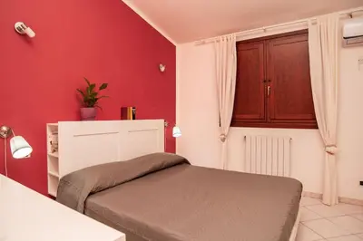 Letto o letti in una camera di Casa Nettuno
