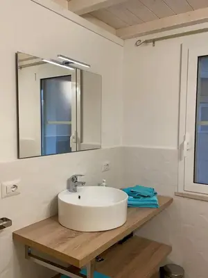Bagno di Casa con giardino vicino al mare