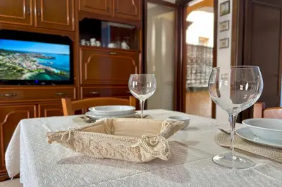 TV o dispositivi per l'intrattenimento presso Cabras casa vacanze a 2 piani