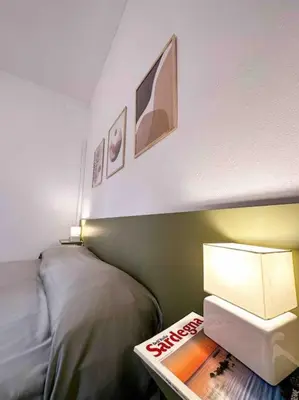 Letto o letti in una camera di Casa vacanze “Tuvixeddu”