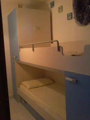 Letto o letti in una camera di Costa Rei casa vacanze Gi.&Gi.