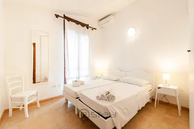 Letto o letti in una camera di Casa Nicole