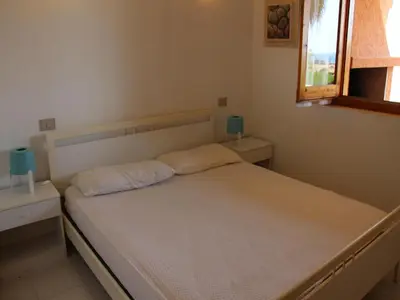 Letto o letti in una camera di Apartments Costa Rei