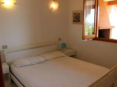 Letto o letti in una camera di Apartment in Costa Rei near White Sandy Beach