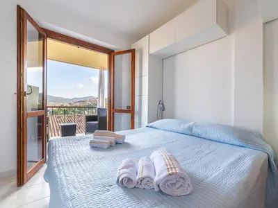 Letto o letti in una camera di CASABIANCOMARE