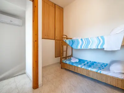 Letto o letti in una camera di CASABIANCOMARE