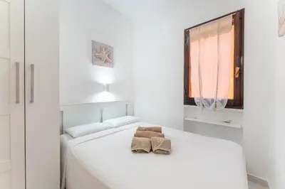 Letto o letti in una camera di Casa Mimose, 200m to beach SouthSardiniaHolidays