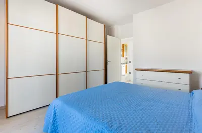 Letto o letti in una camera di GuestHost - Quartu Sant'Elena Roomy Flat with Private Parking!