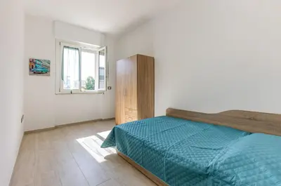 Letto o letti in una camera di GuestHost - Quartu Sant'Elena Roomy Flat with Private Parking!