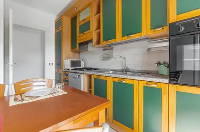 Cucina o angolo cottura di GuestHost - Quartu Sant'Elena Roomy Flat with Private Parking!