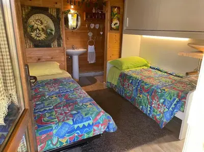 Letto o letti in una camera di Casa Nuvola