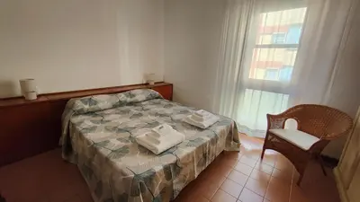 Letto o letti in una camera di PoliHouse - Policlinico Monserrato