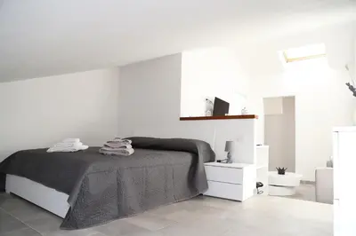 Letto o letti in una camera di GuestHost - Al civico 5 - Mondern Apartments & Suite!