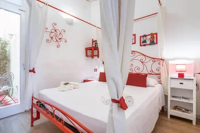 Letto o letti in una camera di CHARMING HOUSE con doccia sensoriale e cortile interno - CENTRO STORICO