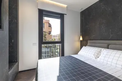Letto o letti in una camera di Vittoria's Luxury Apartment Cagliari