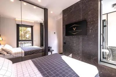 Letto o letti in una camera di Vittoria's Luxury Apartment Cagliari