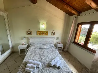 Letto o letti in una camera di L'Incanto Tanca Piras