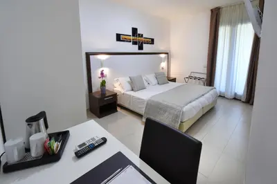 Letto o letti in una camera di Xenia Hotel