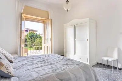 Letto o letti in una camera di Casa Eleonora con parcheggio