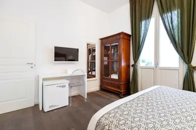 Letto o letti in una camera di Efamoresca