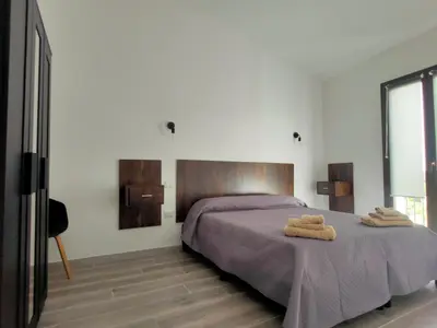Letto o letti in una camera di residence Sant'Anna i4MORI