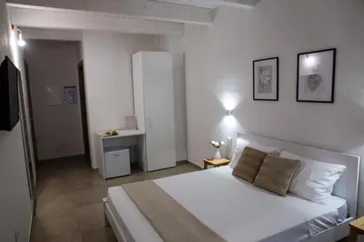 Letto o letti in una camera di DoMe Affittacamere