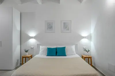 Letto o letti in una camera di DoMe Affittacamere
