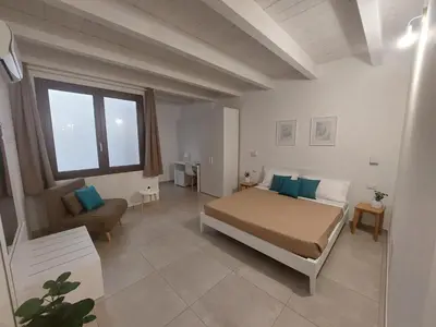 Letto o letti in una camera di DoMe Affittacamere