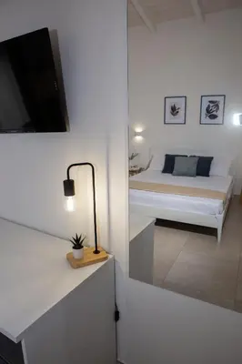Letto o letti in una camera di DoMe Affittacamere